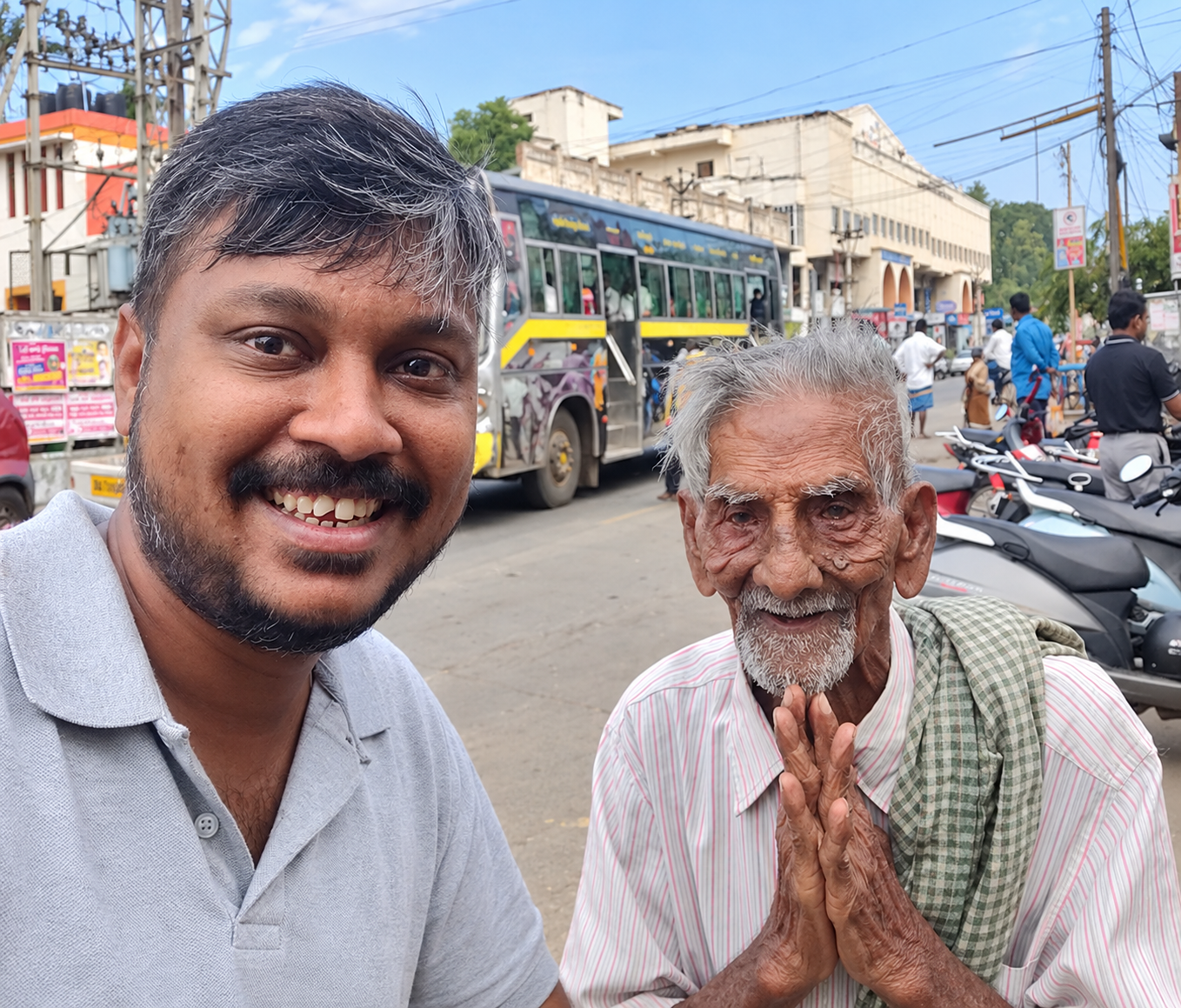 Kalvi Kattanam Foundation volunteer with an elderly man served through Strike The Hunger